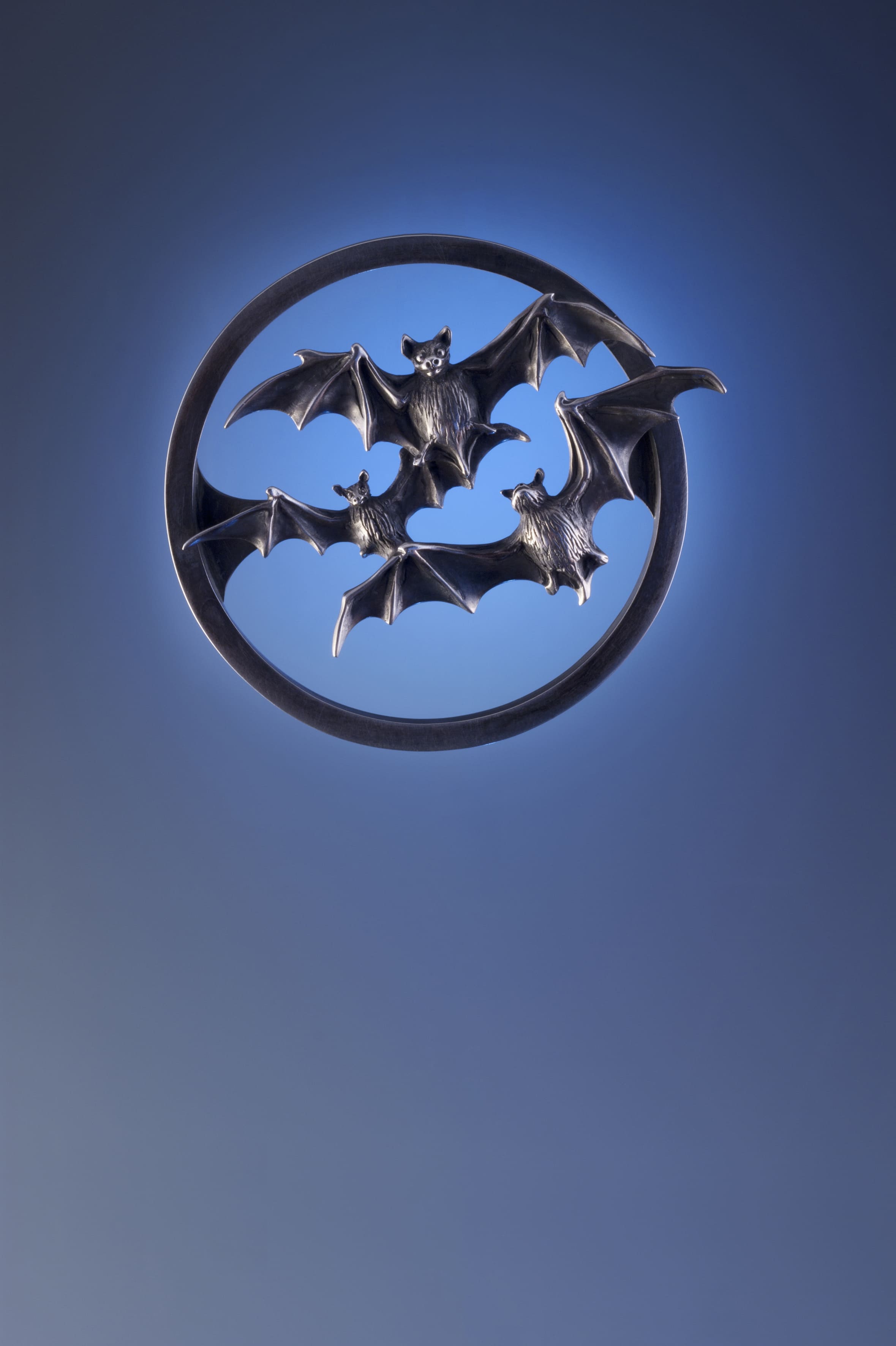 Bats over a clear Moon